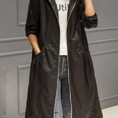 Women's waterproof long trench coat with hood and zip-up front, Christine Brewer's Layla raincoat in outdoor-ready design