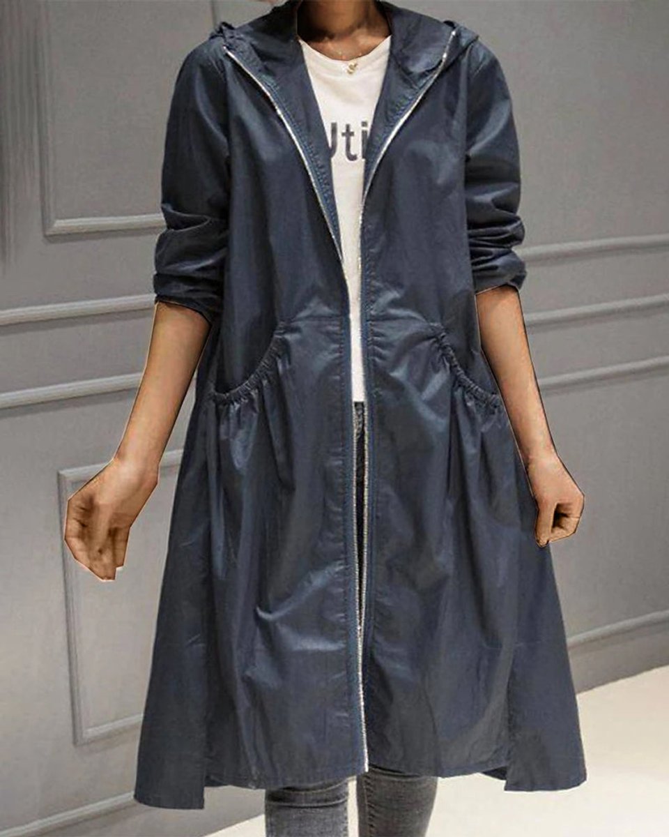 Women’s hooded waterproof long trench coat by Christine Brewer with a zip-up front, designed for rain protection and stylish comfort.