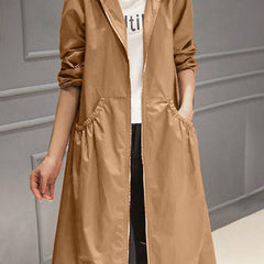 Women's waterproof long trench coat with hood and zip-up front by Christine Brewer, ideal for rainy weather.