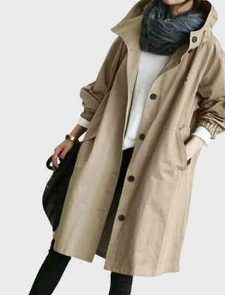 Women's waterproof hooded long trench coat by Christine Brewer, relaxed fit, stylish and functional for rainy weather.