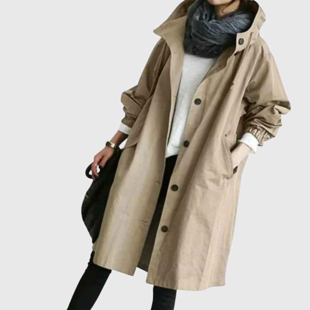 Women's waterproof hooded long trench coat by Christine Brewer, relaxed fit, stylish and functional for rainy weather.