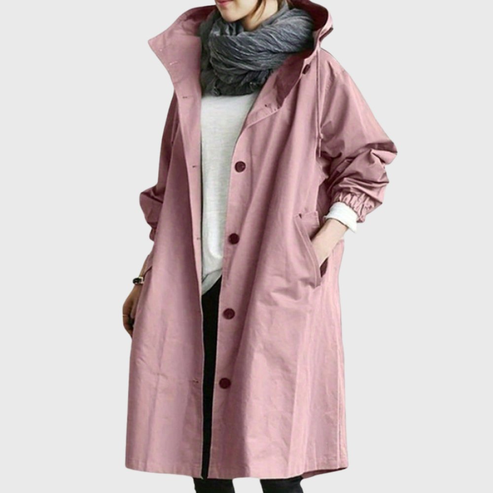 Women’s waterproof hooded long trench coat by Christine Brewer, relaxed fit with a hood, suitable for rainy weather.