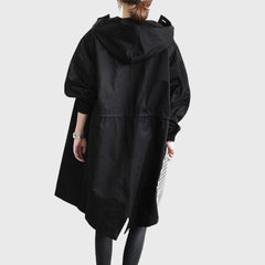 Women's waterproof hooded long trench coat by Christine Brewer, relaxed fit, stylish and functional for rainy weather.