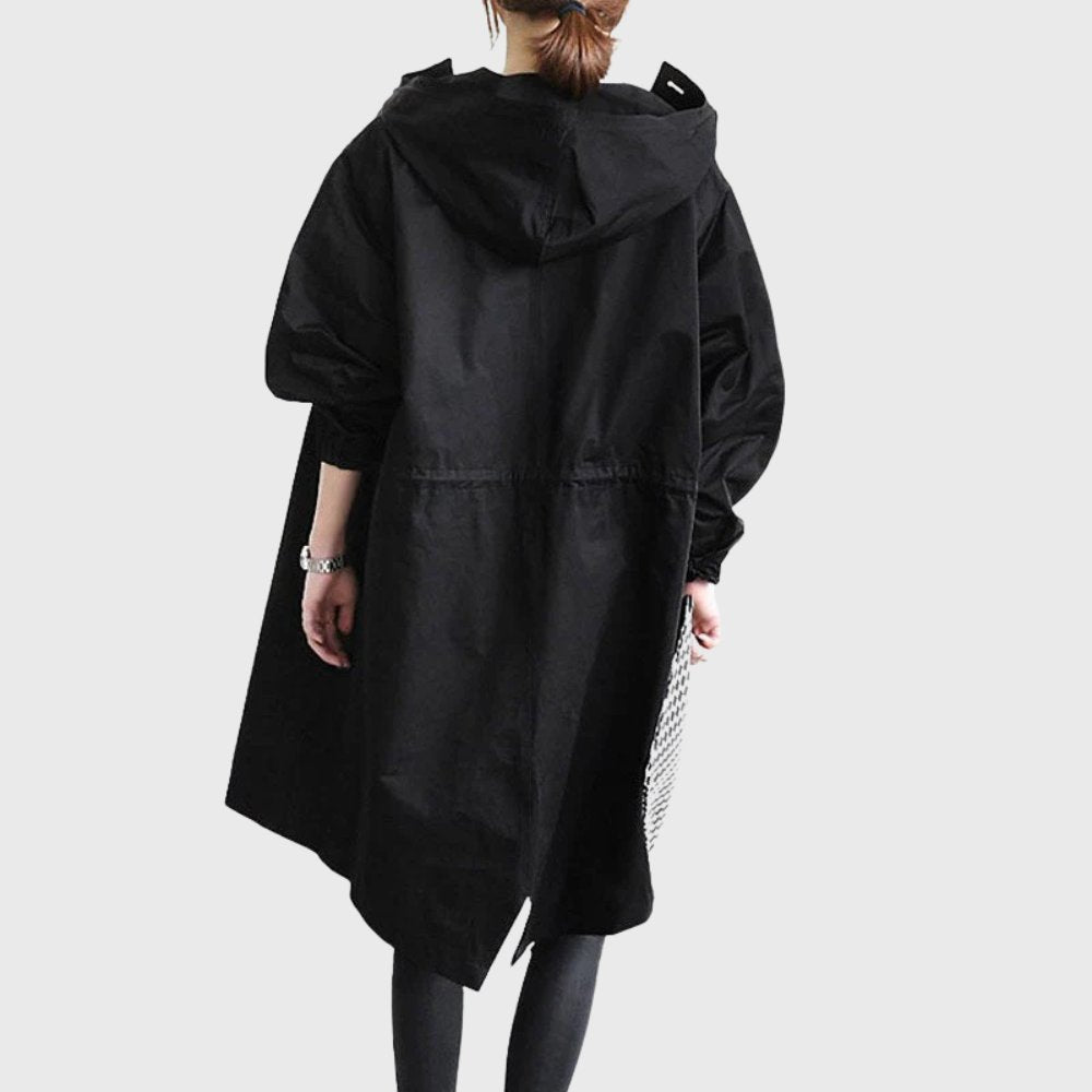 Women's waterproof hooded long trench coat by Christine Brewer, relaxed fit, stylish and functional for rainy weather.