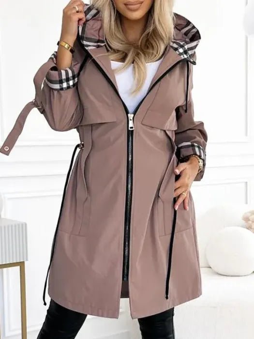 Evelyn women's waterproof windproof zip trench coat in weather-resistant fabric, featuring a hood and stylish design.