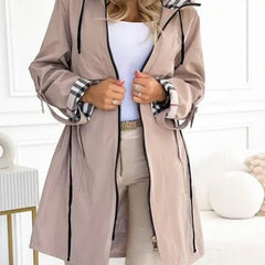 Women’s waterproof windproof zip trench coat with hood, weather-resistant design by Christine Brewer, ideal for rainy, windy days.