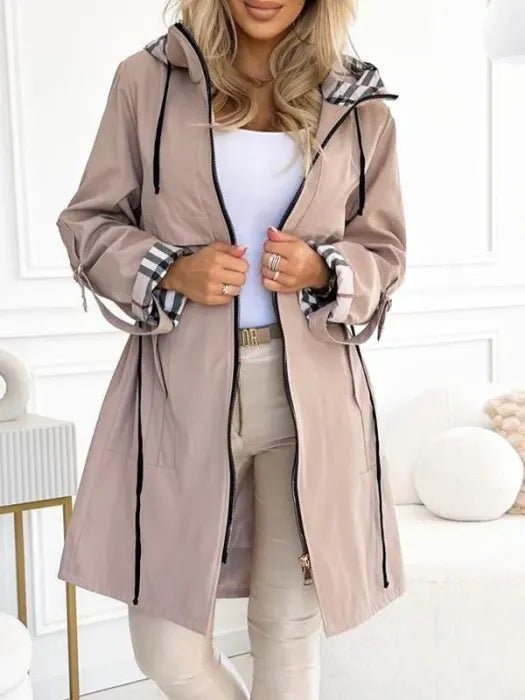Women’s waterproof windproof zip trench coat with hood, weather-resistant design by Christine Brewer, ideal for rainy, windy days.