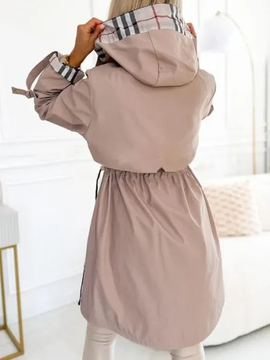 Women's Evelyn waterproof windproof zip trench coat by Christine Brewer, featuring a hood and weather-resistant fabric.