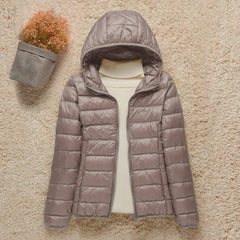 Women's Sienna lightweight hooded quilted jacket by Christine Brewer, packable down puffer with a cozy hood and quilted design.