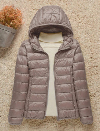 Women's Sienna lightweight hooded quilted jacket by Christine Brewer, packable down puffer with a cozy hood and quilted design.