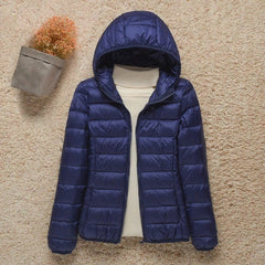 Women's Sienna lightweight hooded quilted jacket by Christine Brewer, packable down puffer with a hood and quilted design.