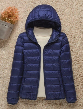 Women's Sienna lightweight hooded quilted jacket by Christine Brewer, packable down puffer with a hood and quilted design.