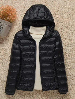 Women's Sienna lightweight hooded quilted jacket by Christine Brewer, packable down puffer with a cozy hood and quilted design.
