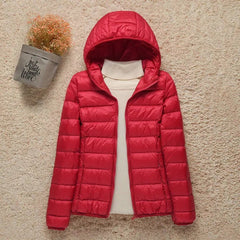 Women's Sienna lightweight hooded quilted jacket by Christine Brewer, packable down puffer with a hood and quilted design.