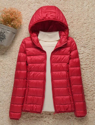 Women's Sienna lightweight hooded quilted jacket by Christine Brewer, packable down puffer with a hood and quilted design.