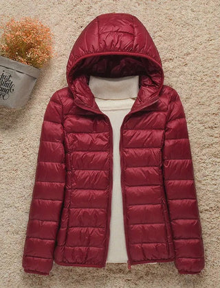 Women’s Sienna lightweight hooded quilted jacket by Christine Brewer, packable down puffer with hood, perfect for cold weather.