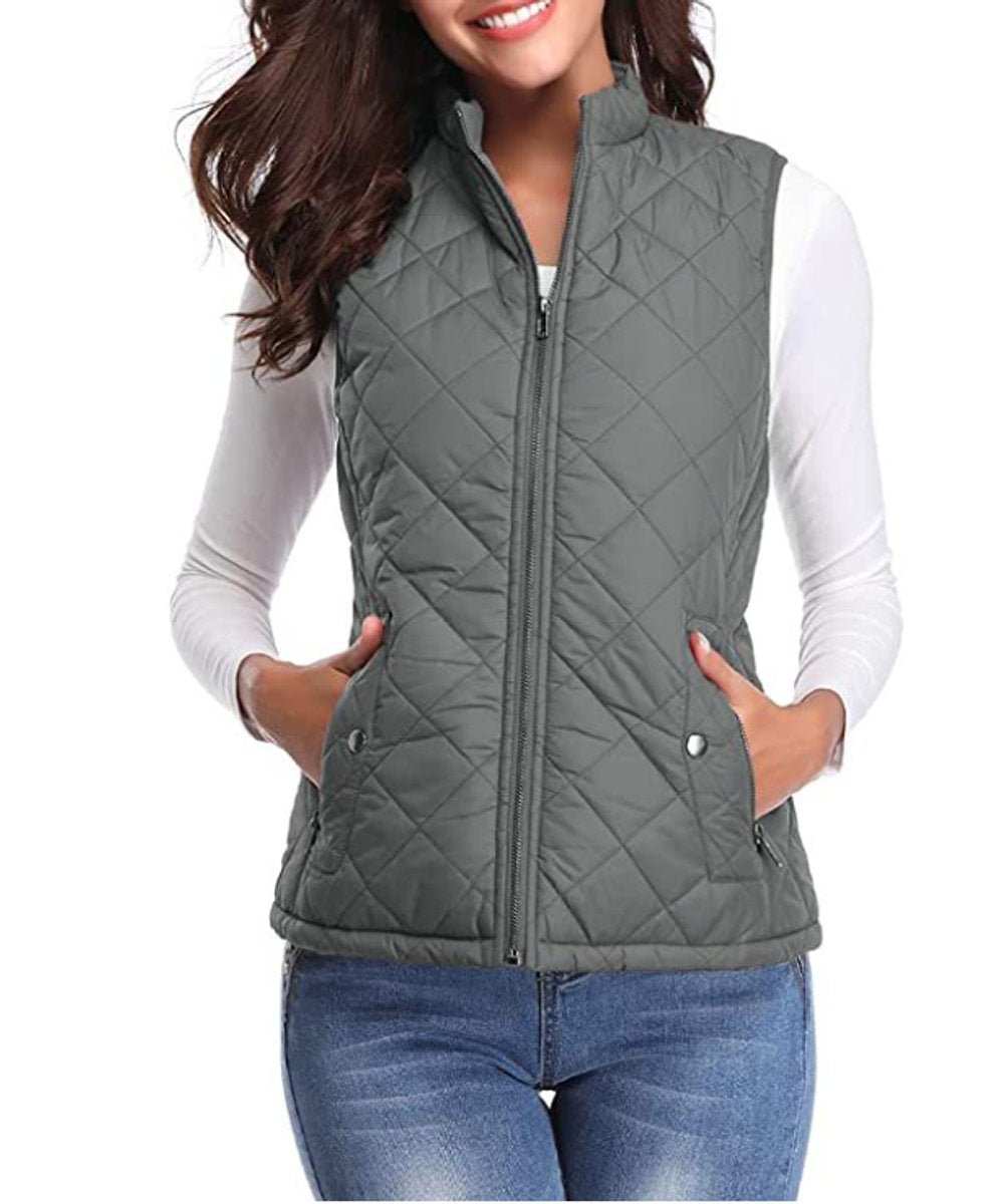 Women’s lightweight quilted sleeveless gilet by Christine Brewer, featuring a zip-up front and a fitted, stylish design.