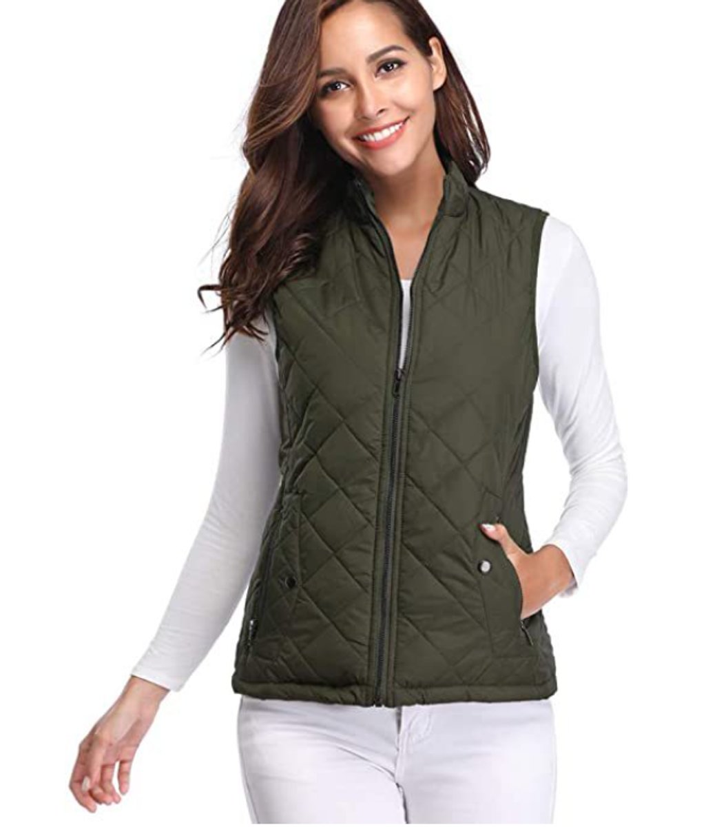 Women’s lightweight quilted sleeveless gilet by Christine Brewer, zip-up design, perfect for layering and casual wear.