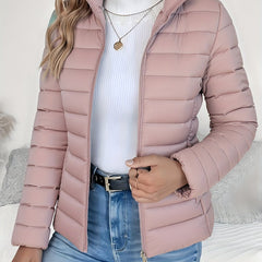 Women's lightweight quilted puffer coat with stand collar and zip-up front by Christine Brewer, shown in a stylish, padded design.