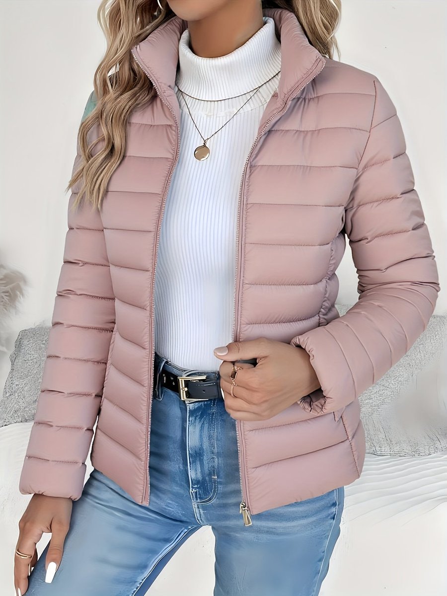 Women's lightweight quilted puffer coat with stand collar and zip-up front by Christine Brewer, shown in a stylish, padded design.
