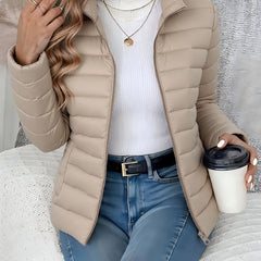 Women's lightweight quilted puffer coat by Christine Brewer with stand collar and zip-up front, perfect for casual winter wear.