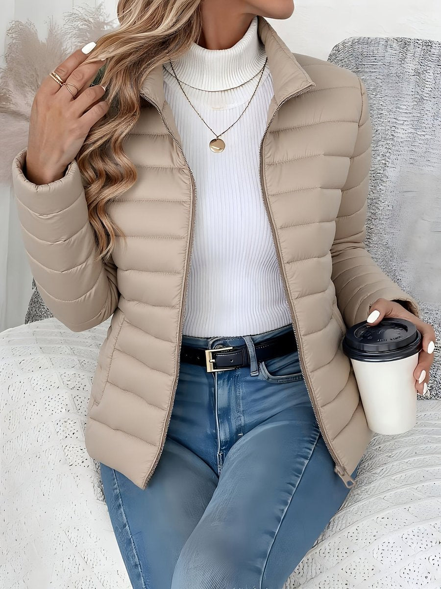 Women's lightweight quilted puffer coat by Christine Brewer with stand collar and zip-up front, perfect for casual winter wear.