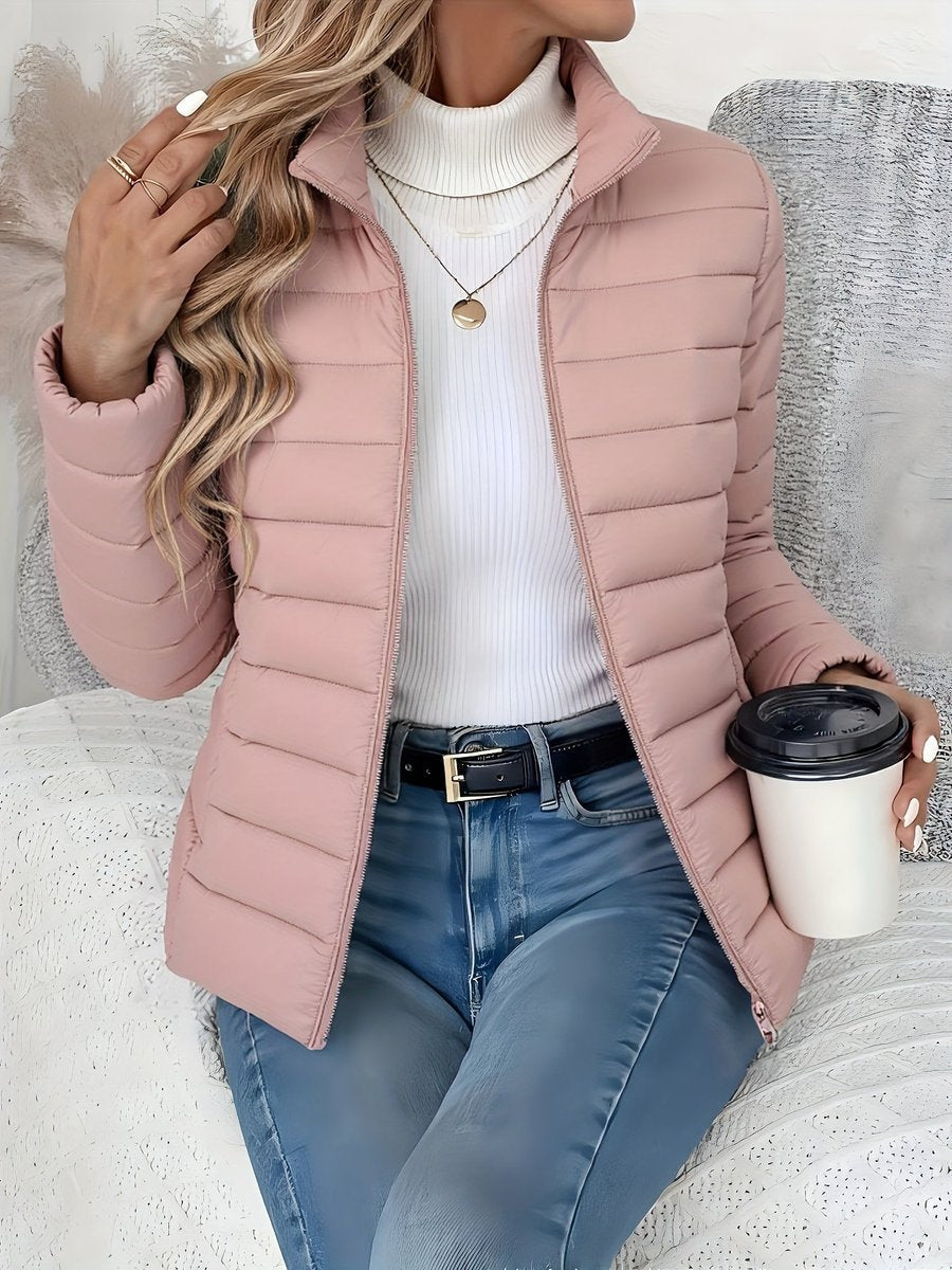 Women's lightweight quilted puffer coat with stand collar and zip-up front by Christine Brewer, perfect for chilly weather.