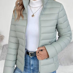 Women's Sienna lightweight quilted puffer jacket with stand collar by Christine Brewer, shown in a close-up view.