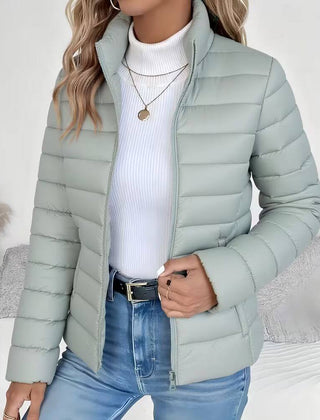 Women's Sienna lightweight quilted puffer jacket with stand collar by Christine Brewer, shown in a close-up view.