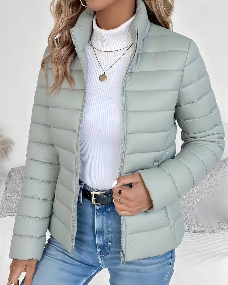Women's Sienna lightweight quilted puffer jacket with stand collar by Christine Brewer, shown in a close-up view.