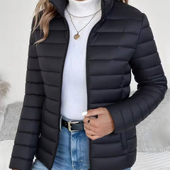 Women's Sienna lightweight quilted puffer jacket with stand collar by Christine Brewer, displayed with a front view.