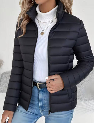 Women's Sienna lightweight quilted puffer jacket with stand collar by Christine Brewer, displayed with a front view.