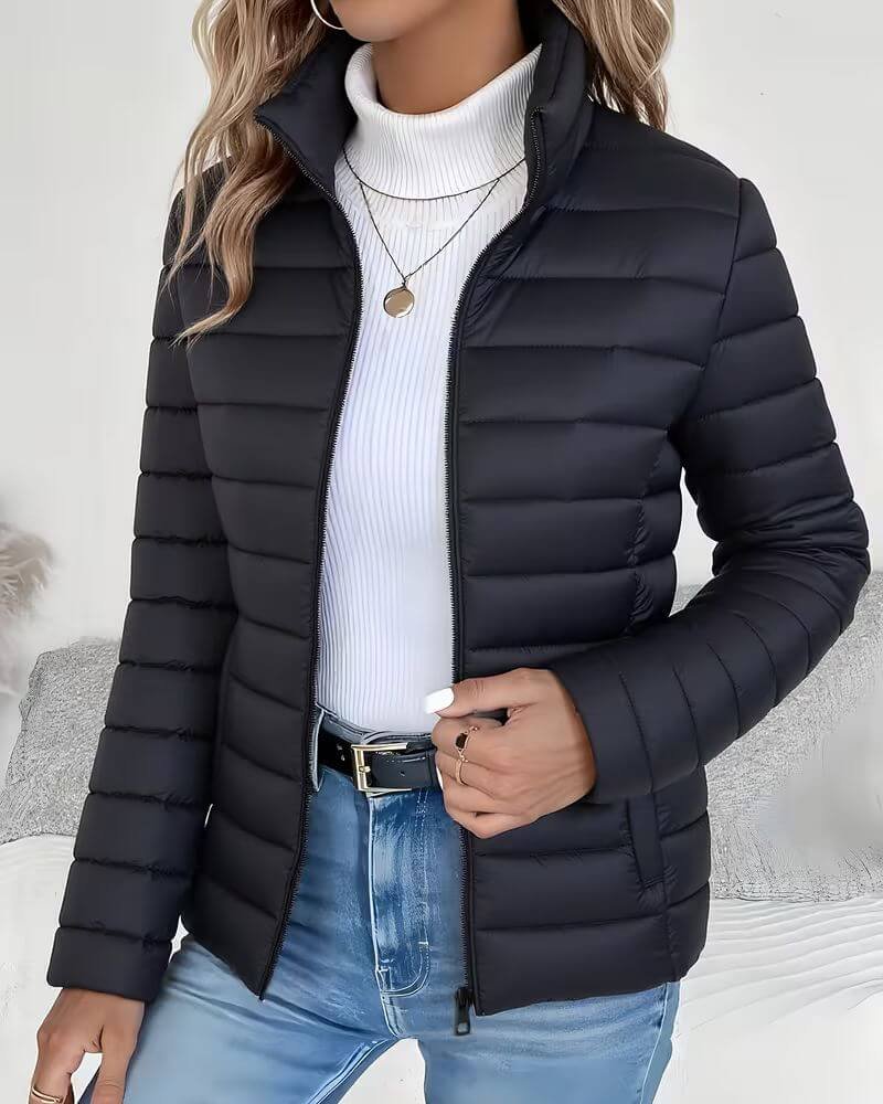 Women's Sienna lightweight quilted puffer jacket with stand collar by Christine Brewer, displayed with a front view.