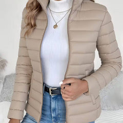 Women's lightweight quilted puffer jacket with stand collar by Christine Brewer, shown in a stylish and cozy design.
