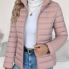 Women's Sienna lightweight quilted puffer jacket with stand collar by Christine Brewer, shown in a fitted, stylish design.