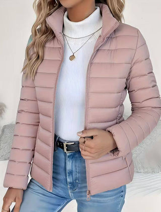 Women's Sienna lightweight quilted puffer jacket with stand collar by Christine Brewer, shown in a fitted, stylish design.