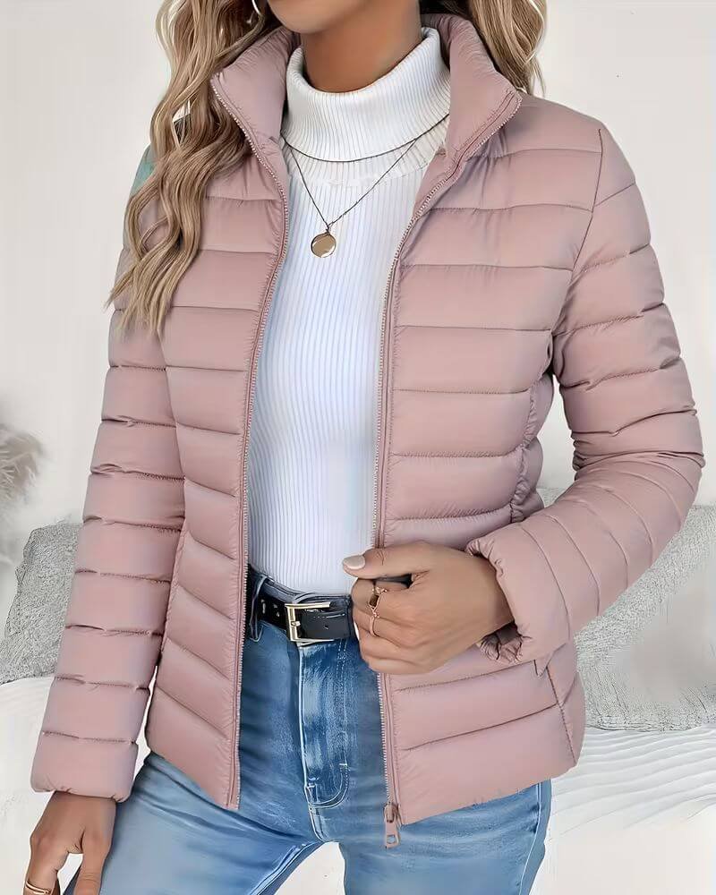Women's Sienna lightweight quilted puffer jacket with stand collar by Christine Brewer, shown in a fitted, stylish design.