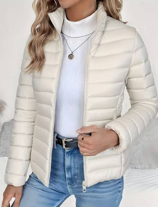 Women’s Sienna lightweight quilted puffer jacket with stand collar by Christine Brewer, shown in a stylish, padded design.