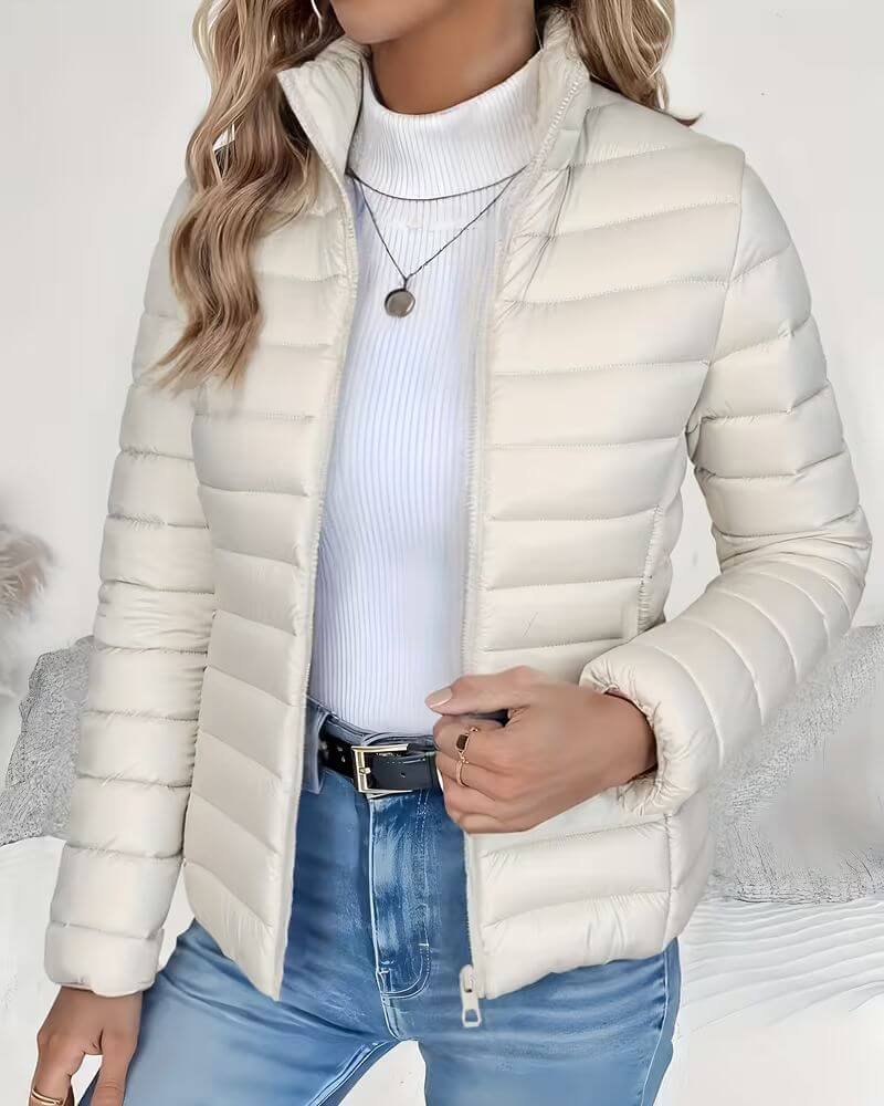 Women’s Sienna lightweight quilted puffer jacket with stand collar by Christine Brewer, shown in a stylish, padded design.