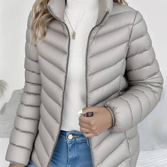 Women's Sienna lightweight quilted puffer jacket with stand collar by Christine Brewer, visible with a sleek, insulated design.