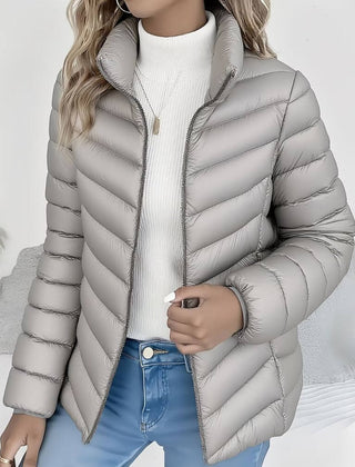 Women's Sienna lightweight quilted puffer jacket with stand collar by Christine Brewer, visible with a sleek, insulated design.