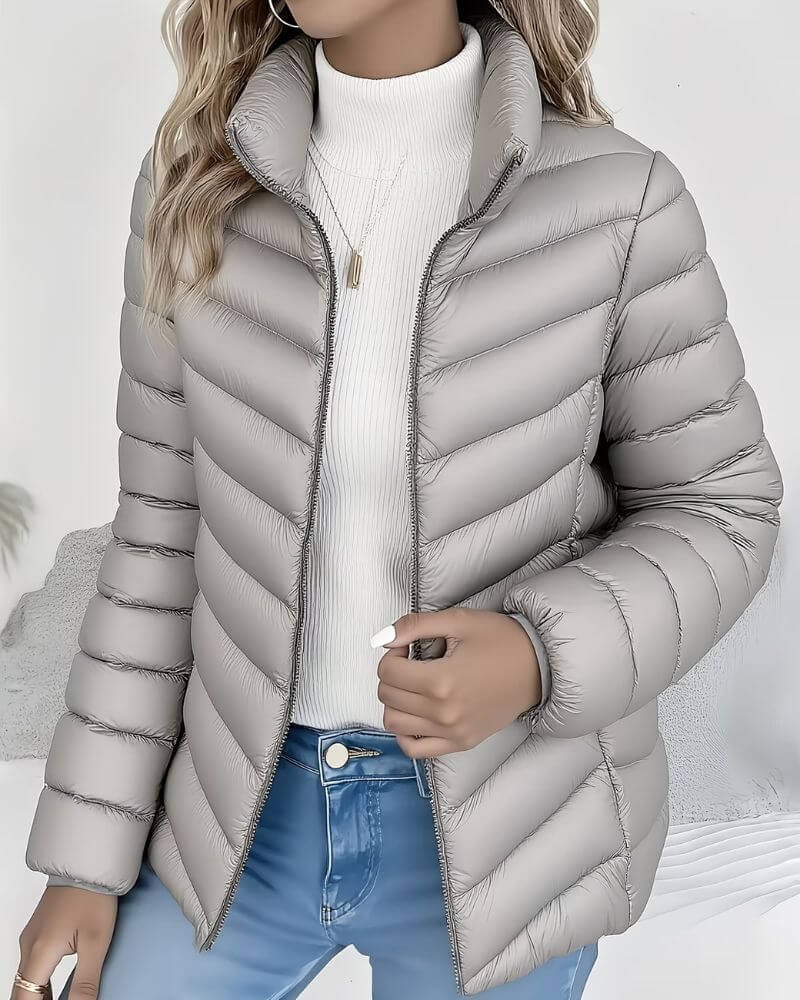 Women's Sienna lightweight quilted puffer jacket with stand collar by Christine Brewer, visible with a sleek, insulated design.