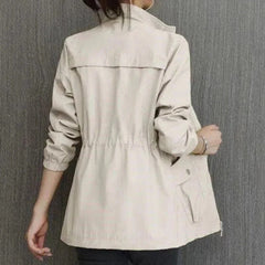Women’s Sienna lightweight zip-up bomber jacket with drawstring waist by Christine Brewer, shown in a stylish transitional design.