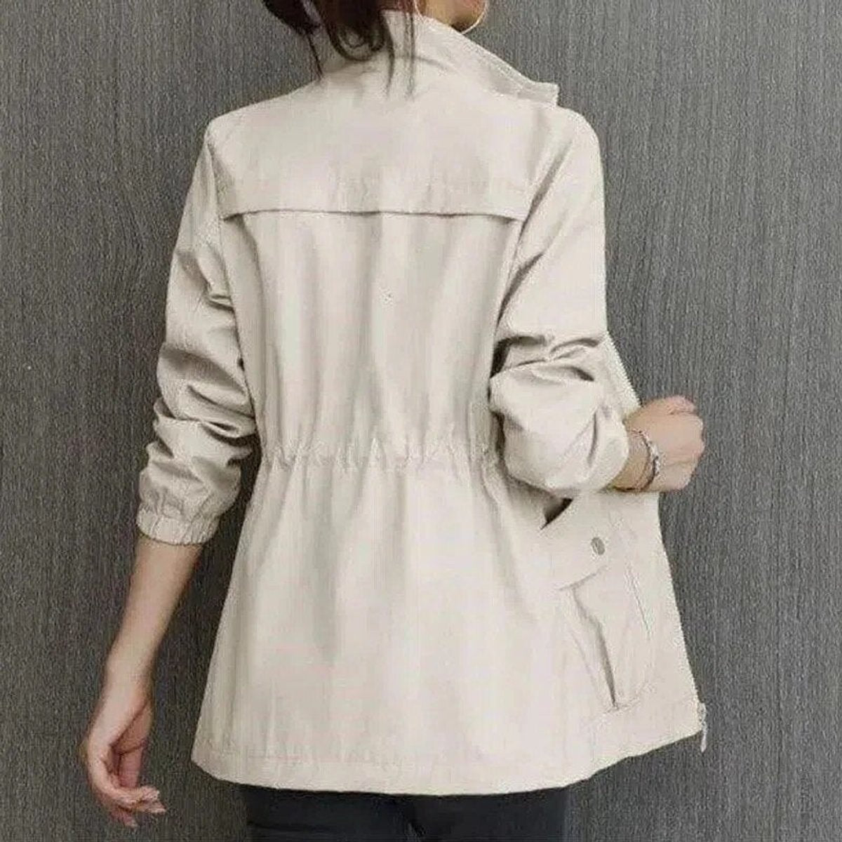 Women’s Sienna lightweight zip-up bomber jacket with drawstring waist by Christine Brewer, shown in a stylish transitional design.