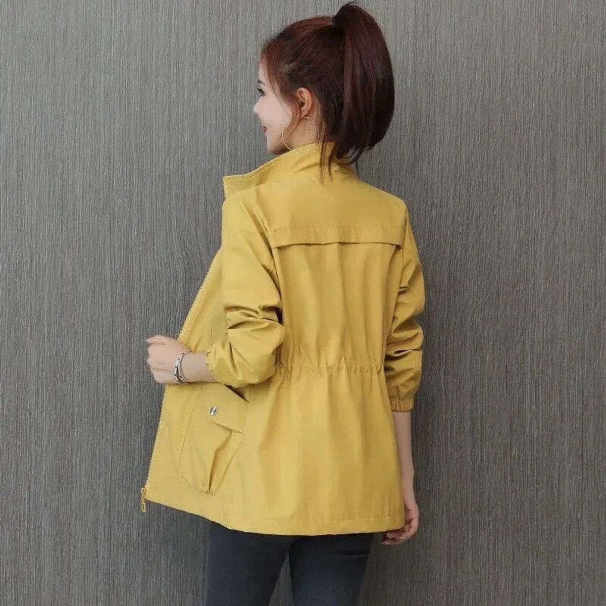 Women's Sienna lightweight zip-up transitional bomber jacket with drawstring details, from Christine Brewer, shown on a woman.