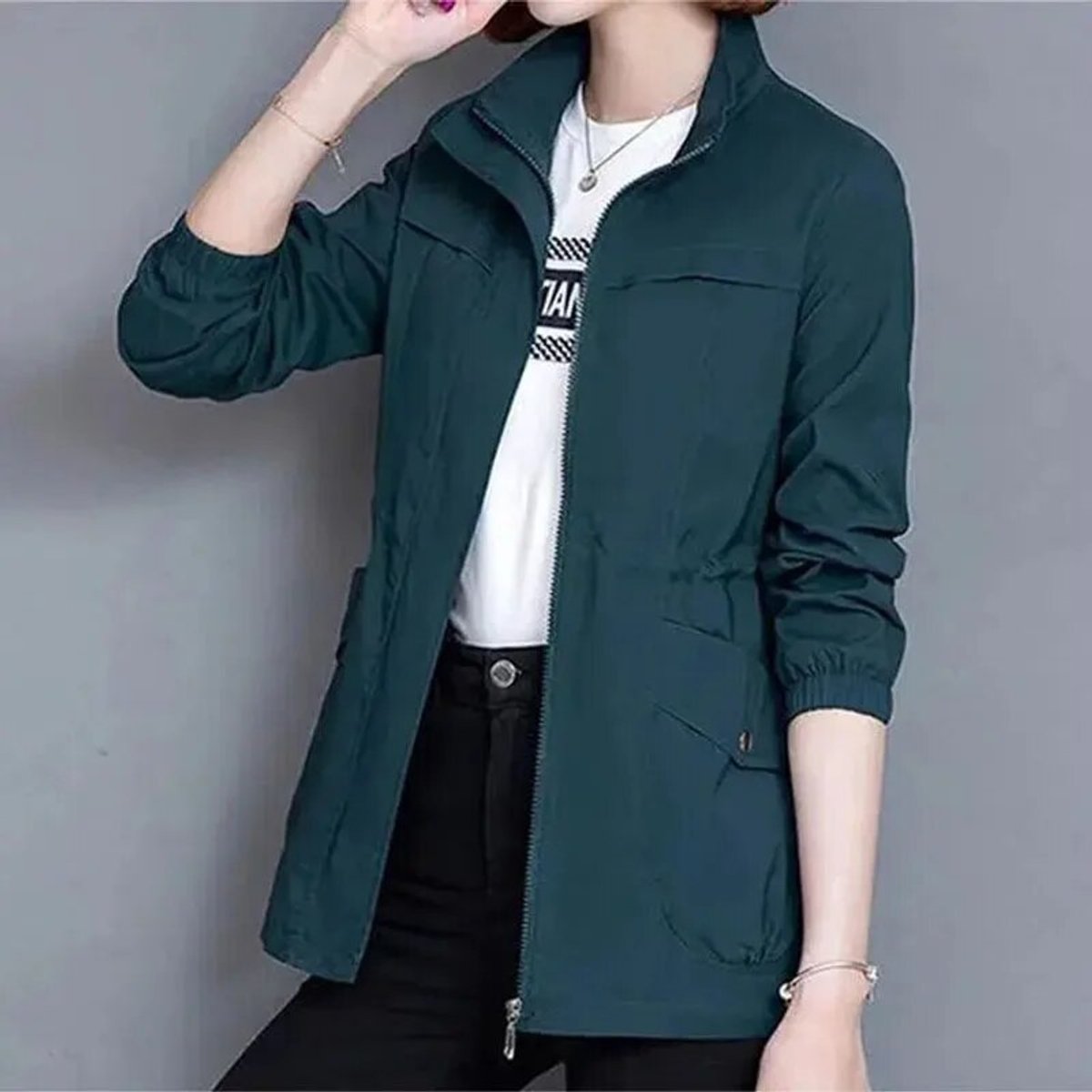 Lightweight women's zip-up bomber jacket with drawstring waist from Christine Brewer, featuring a transitional design and casual style.