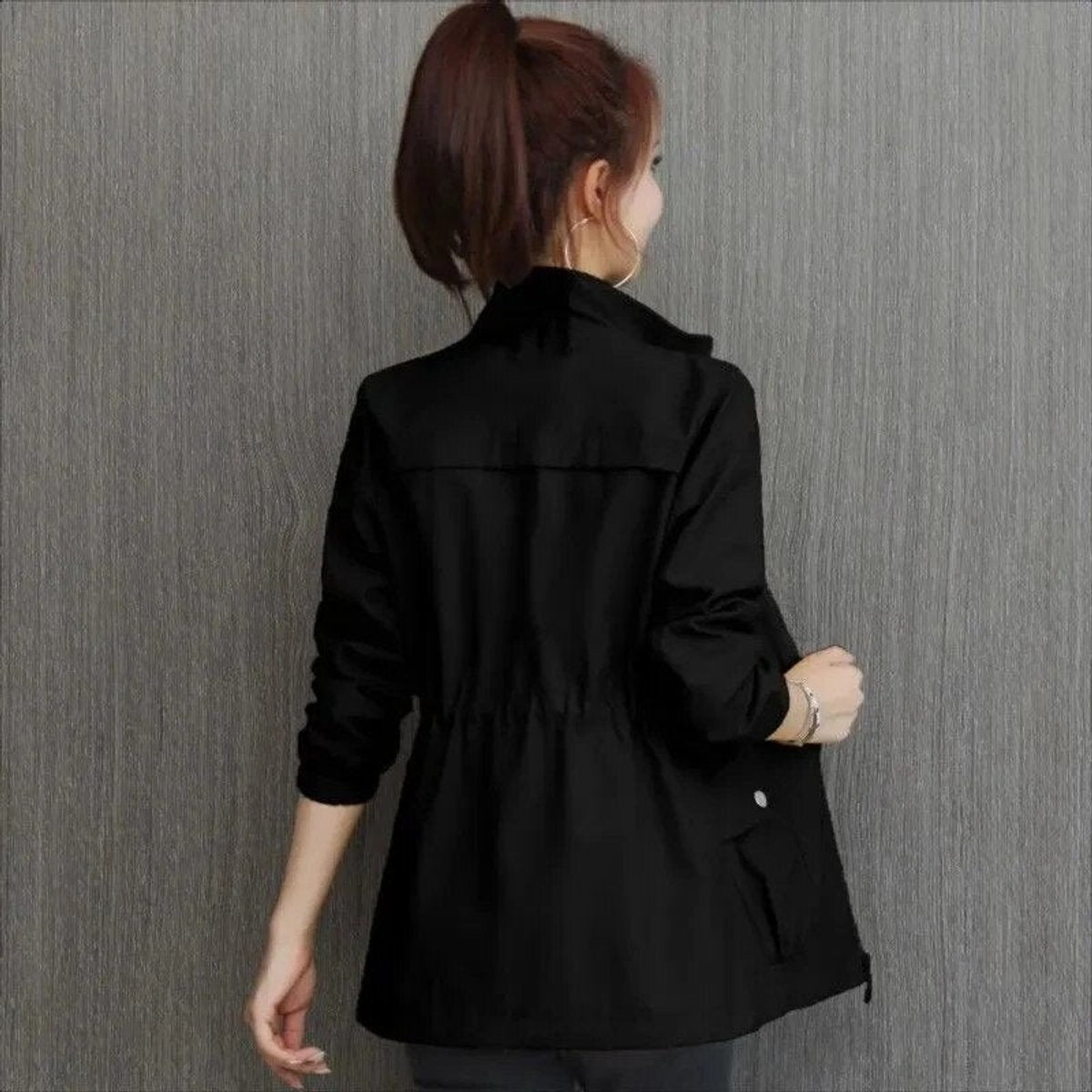 Women's lightweight zip-up short bomber jacket with drawstring waist, casual style by Christine Brewer.