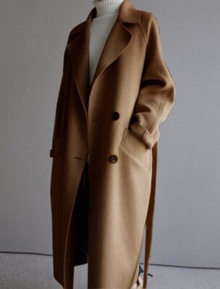 Women’s long double-breasted cashmere blend coat by Christine Brewer, showcasing tailored lapels and elegant design.