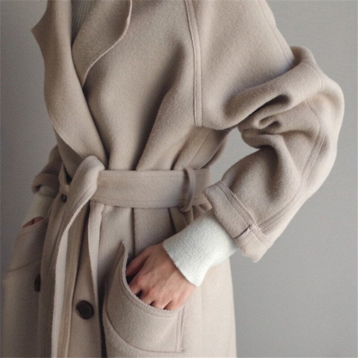 Women’s long double-breasted wool-blend trench coat by Christine Brewer, featuring a classic longline design and tailored fit.