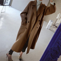 Women's long double-breasted wool-blend trench coat by Christine Brewer, shown in a longline style with classic lapels.